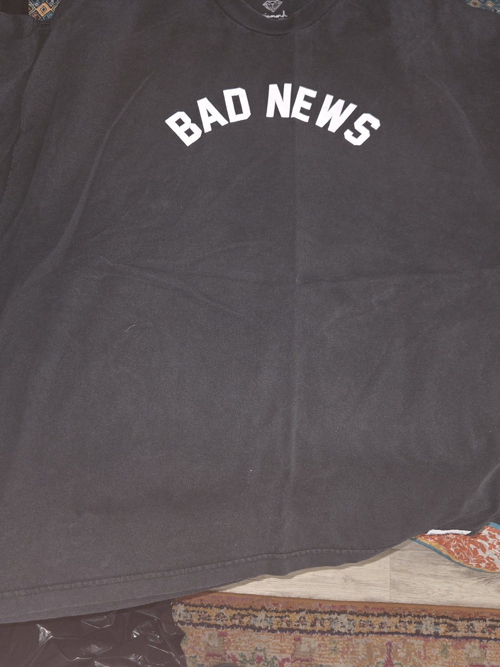 Diamond Black Short Sleeve Tee with White "BAD NEWS" Chest Print